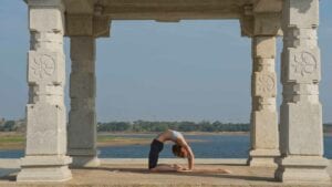 Susan Hounsell, Level 2 Authorised Ashtanga Yoga teacher in Susan Kapotasana beside the Kabini River, Mysore India