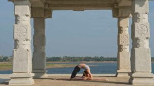 Susan Hounsell, Level 2 Authorised Ashtanga Yoga teacher in Susan Kapotasana beside the Kabini River, Mysore India